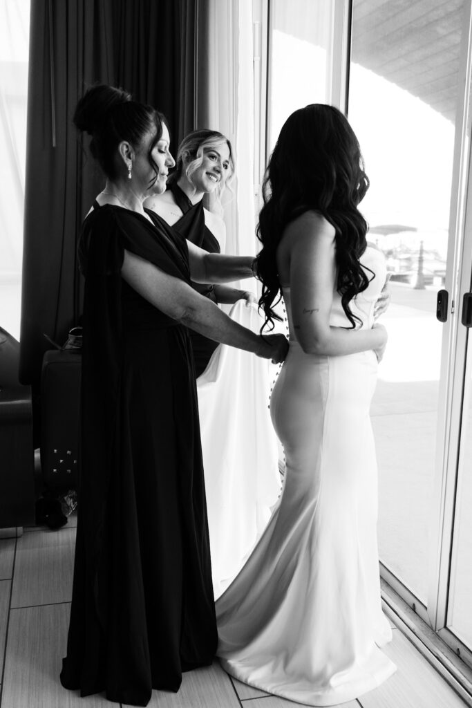 dress details during bride's portrait session in a minimal wedding dress with her mom.