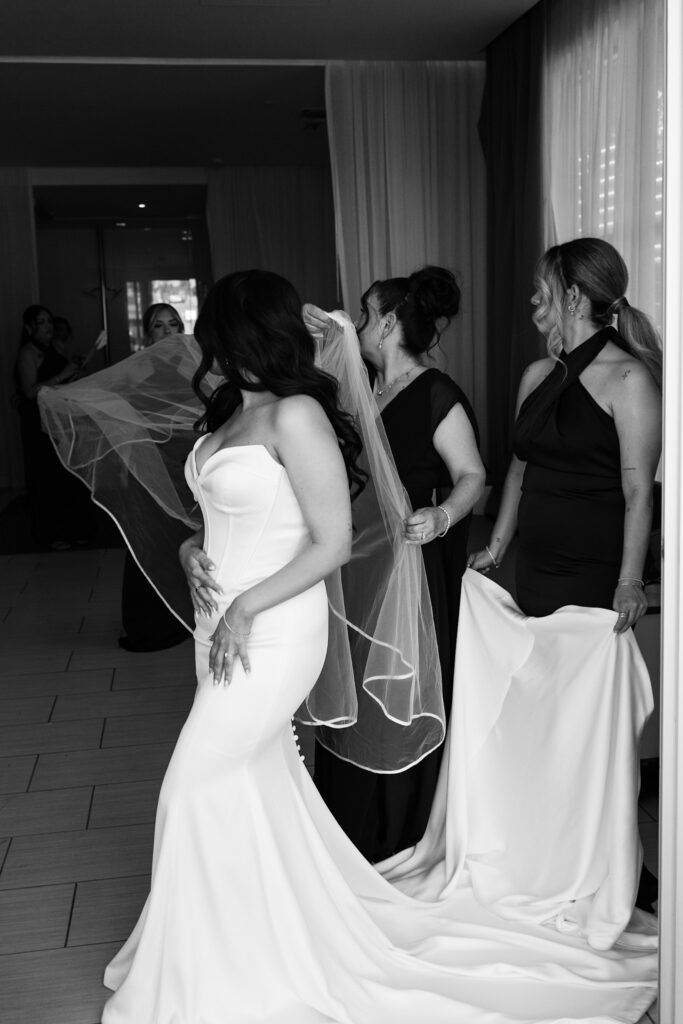 dress details during bride's portrait session in a minimal wedding dress with her mom.
