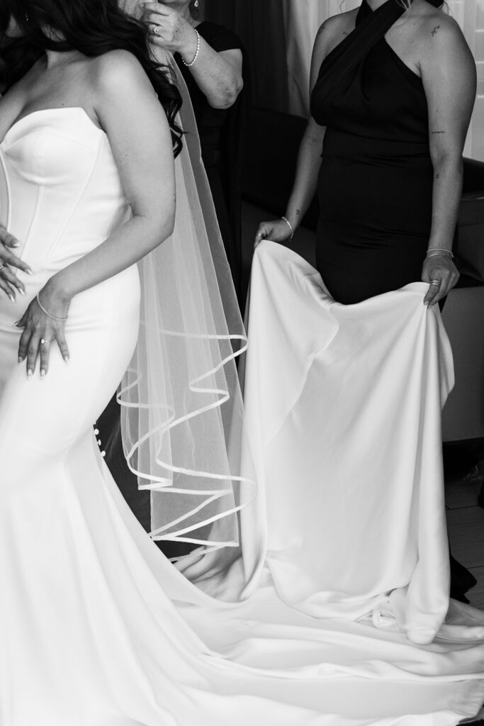 dress details during bride's portrait session in a minimal wedding dress with her mom.