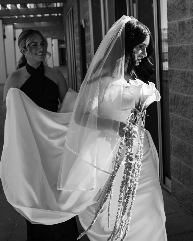 bridesmaid modern portrait session in a minimal wedding dress getting ready for her first look with her brother.
