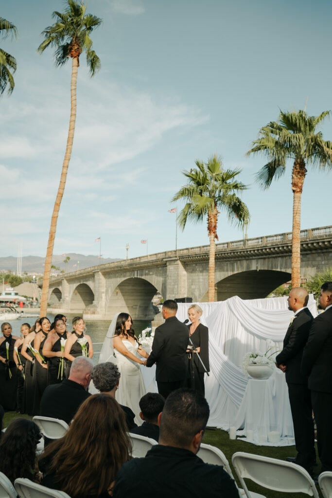 Bride and groom wedding ceremony in front of a the London Bridge during a modern, minimal wedding in Arizona
