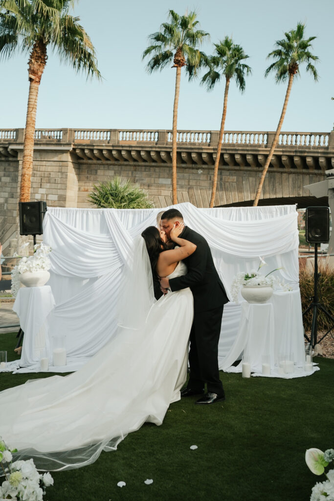 Bride and groom wedding ceremony in front of a the London Bridge during a modern, minimal wedding in Arizona