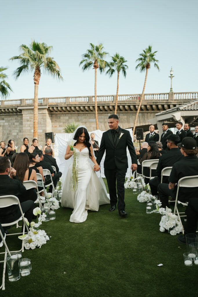 Bride and groom during ceremony in front of a the London Bridge during a modern, minimal wedding in Arizona