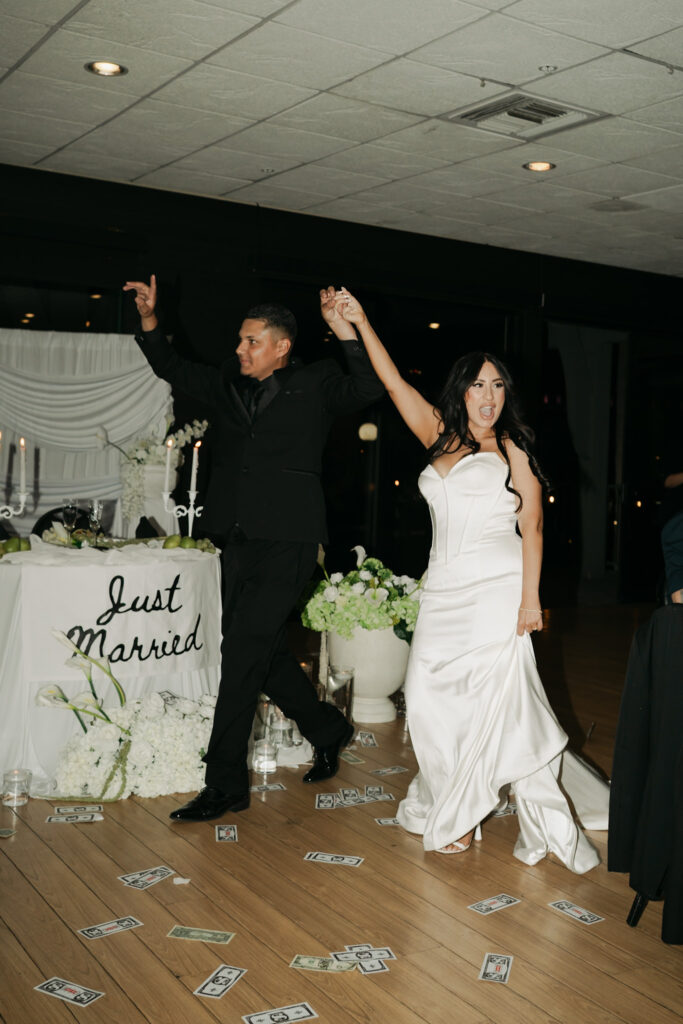 documentary photos of the bride and groom entering their lively reception.