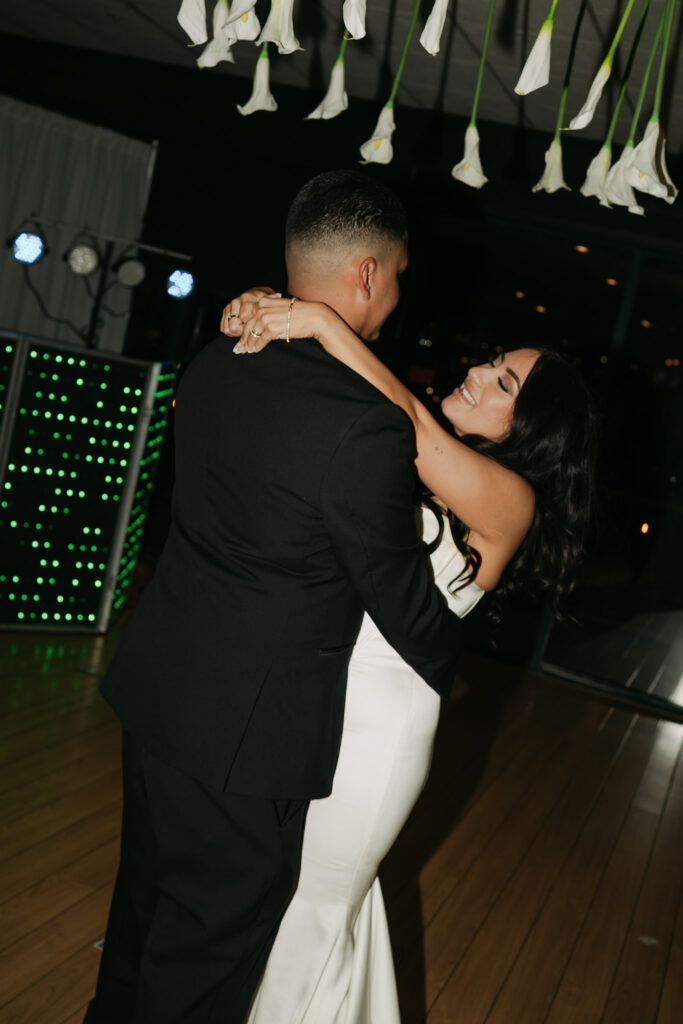 bride and groom's first dance together during their modern reception.