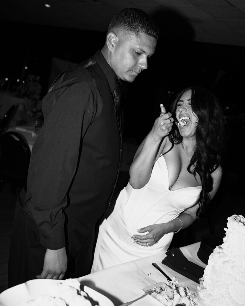 bride and groom cut their cake wedding photos