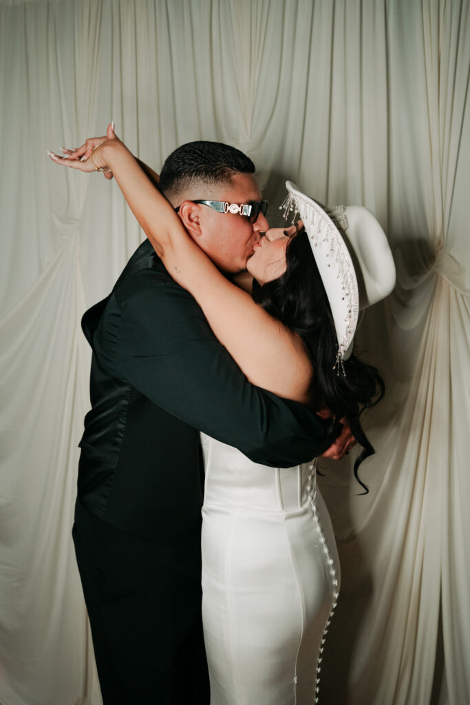 bride and groom photobooth photos during their lively reception